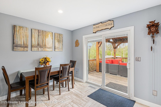 dining area with baseboards, recessed lighting, and visible vents