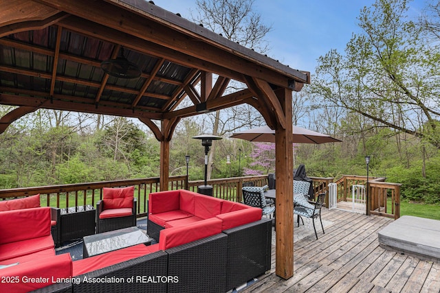 wooden terrace featuring a gazebo and outdoor lounge area