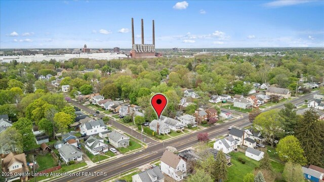 birds eye view of property with a residential view