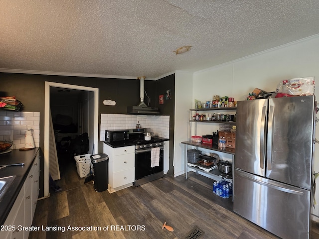 9304-9306 Parkhurst Hwy, Addison, MI 49220 - kitchen with ornamental molding, appliances with stainless steel finishes, and dark countertops