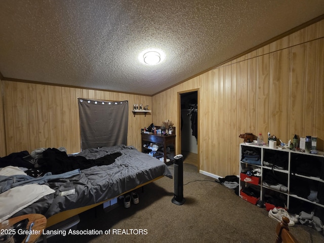 9304-9306 Parkhurst Hwy, Addison, MI 49220 - carpeted bedroom featuring a closet, wooden walls, a textured ceiling, a spacious closet, and vaulted ceiling