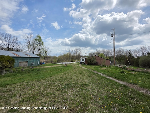 9304-9306 Parkhurst Hwy, Addison, MI 49220 - view of yard with an outdoor structure and an outbuilding