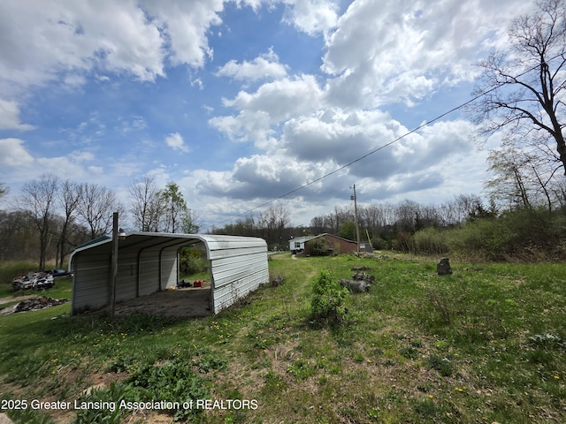 9304-9306 Parkhurst Hwy, Addison, MI 49220 - view of yard with a detached carport
