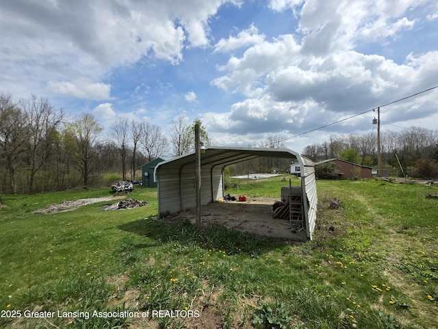 9304-9306 Parkhurst Hwy, Addison, MI 49220 - view of yard featuring driveway and a carport