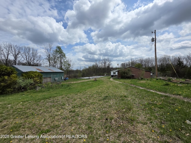 9304-9306 Parkhurst Hwy, Addison, MI 49220 - view of yard with an outbuilding