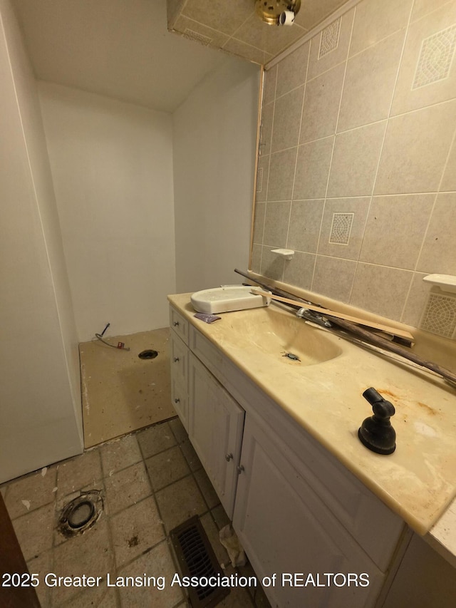 9304-9306 Parkhurst Hwy, Addison, MI 49220 - bathroom with vanity and tasteful backsplash