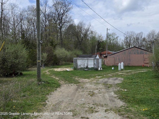 9304-9306 Parkhurst Hwy, Addison, MI 49220 - view of yard with an outdoor structure and a shed