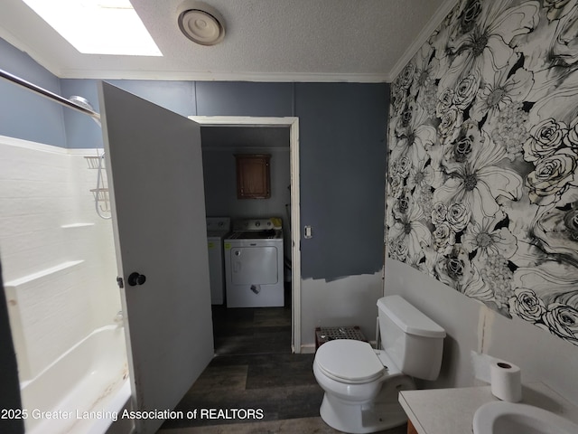 9304-9306 Parkhurst Hwy, Addison, MI 49220 - bathroom with washer and dryer, crown molding, a textured ceiling, vanity, and bathtub / shower combination