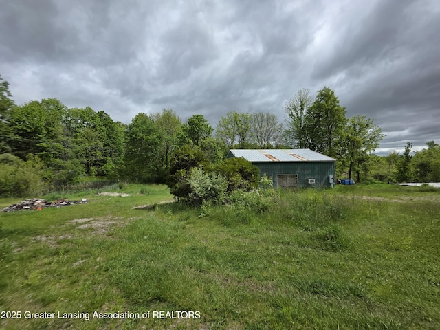 9304-9306 Parkhurst Hwy, Addison, MI 49220 - view of yard featuring a pole building and an outdoor structure
