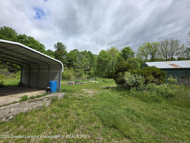 9304-9306 Parkhurst Hwy, Addison, MI 49220 - view of yard featuring a carport and driveway