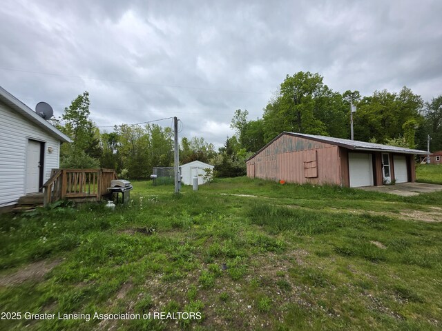 9304-9306 Parkhurst Hwy, Addison, MI 49220 - view of yard featuring an outdoor structure and a detached garage