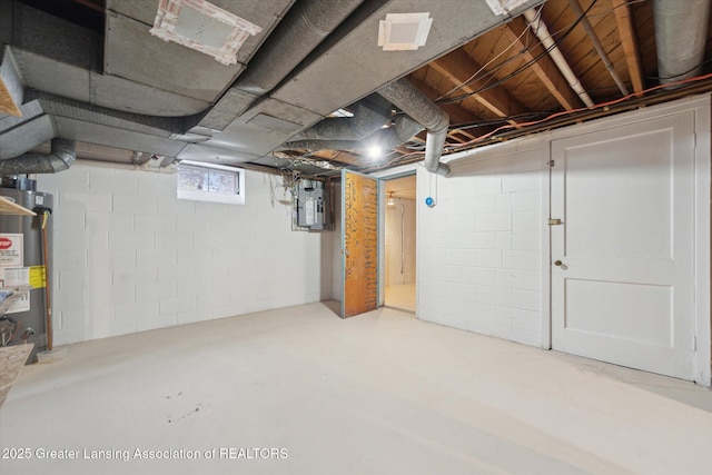 below grade area with electric panel and gas water heater