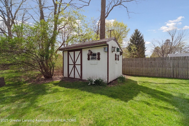 view of shed with fence
