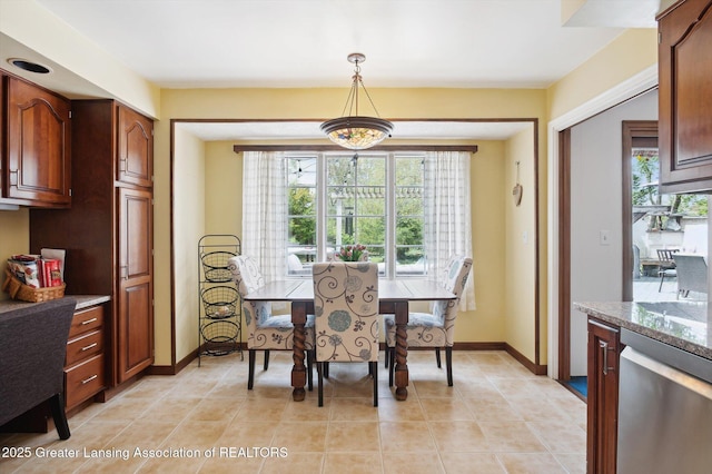 dining room featuring baseboards and light tile patterned floors