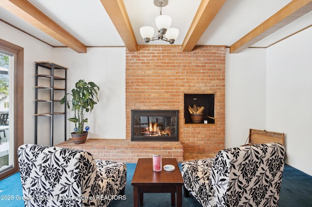 carpeted living area with a brick fireplace, beam ceiling, and a chandelier