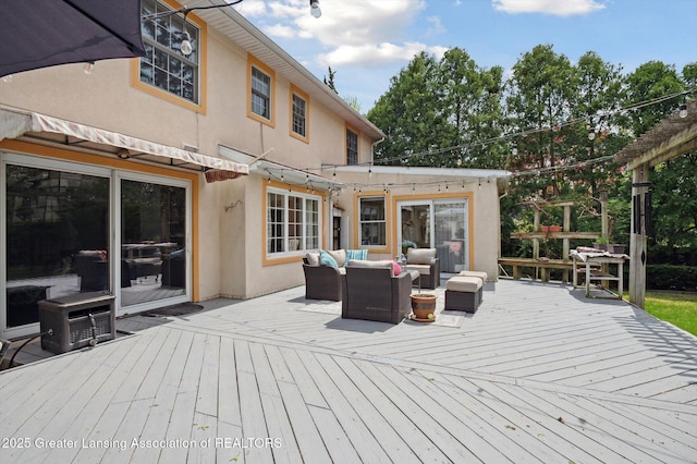 wooden terrace with an outdoor hangout area