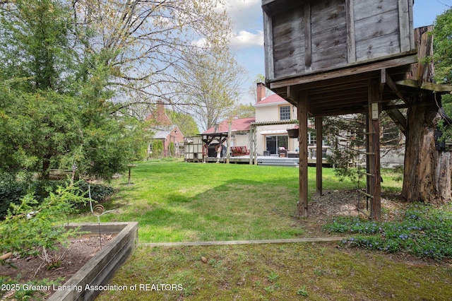view of yard with a deck