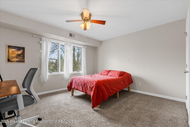 carpeted bedroom featuring visible vents, baseboards, and ceiling fan