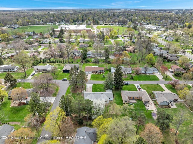birds eye view of property with a residential view