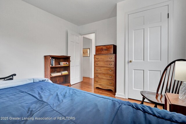 bedroom with wood finished floors