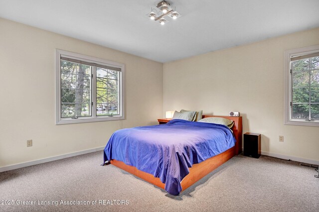 bedroom featuring baseboards, carpet, and visible vents