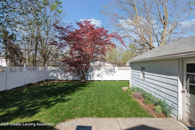 view of yard with a fenced backyard