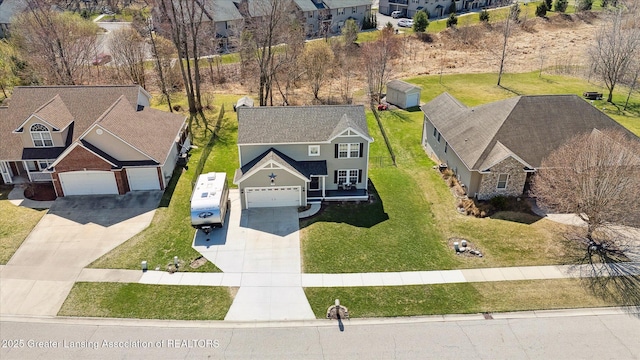 birds eye view of property with a residential view