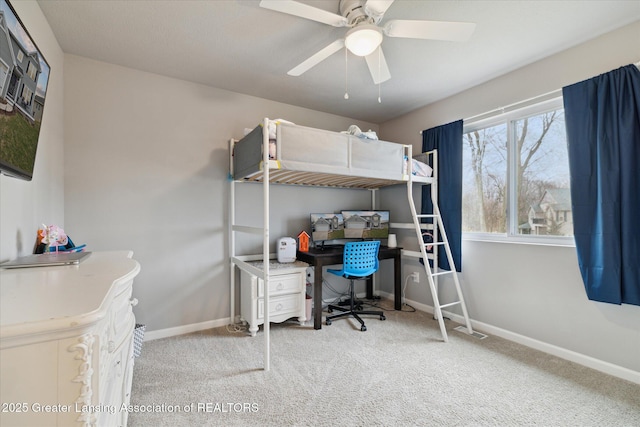 bedroom with baseboards, a ceiling fan, and carpet
