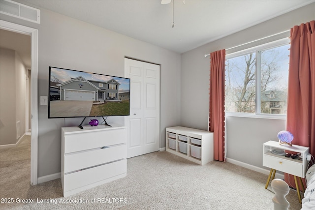 bedroom with visible vents, carpet flooring, and baseboards