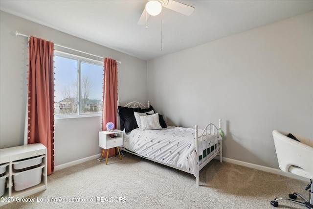 bedroom featuring carpet floors, a ceiling fan, and baseboards