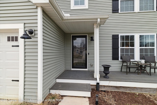 view of exterior entry featuring a garage