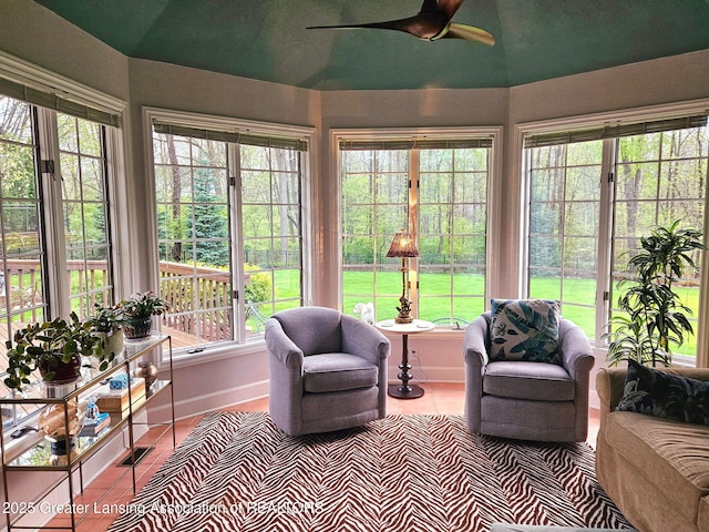 sunroom featuring french doors, visible vents, and a healthy amount of sunlight