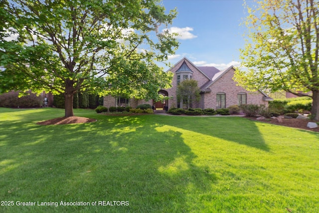 3641 Beech Tree Ln, Okemos, MI 48864 - view of front of home with a front yard and brick siding