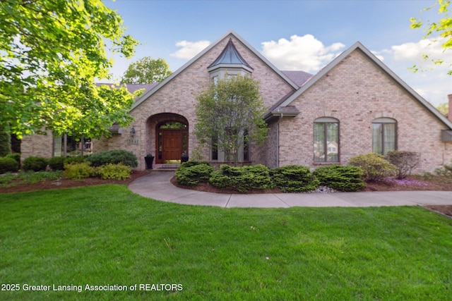 3641 Beech Tree Ln, Okemos, MI 48864 - view of front of home with a front lawn and brick siding