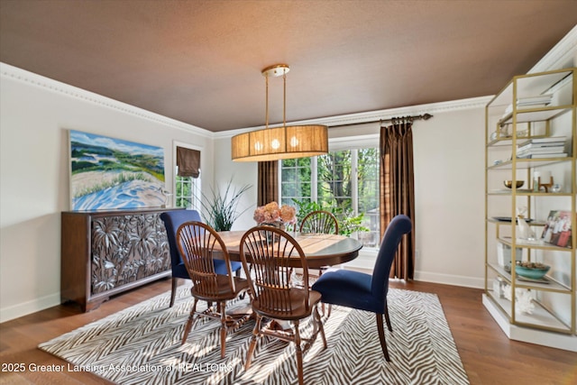 3641 Beech Tree Ln, Okemos, MI 48864 - dining space featuring baseboards, ornamental molding, and wood finished floors