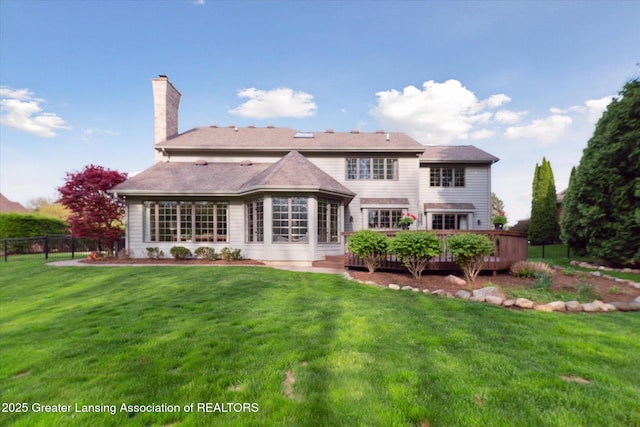 3641 Beech Tree Ln, Okemos, MI 48864 - back of property featuring a wooden deck and a chimney