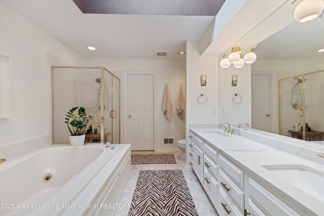 3641 Beech Tree Ln, Okemos, MI 48864 - full bath with a shower stall, a bath, double vanity, toilet, and recessed lighting