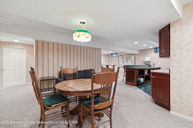 3641 Beech Tree Ln, Okemos, MI 48864 - dining room featuring light carpet, wallpapered walls, and recessed lighting