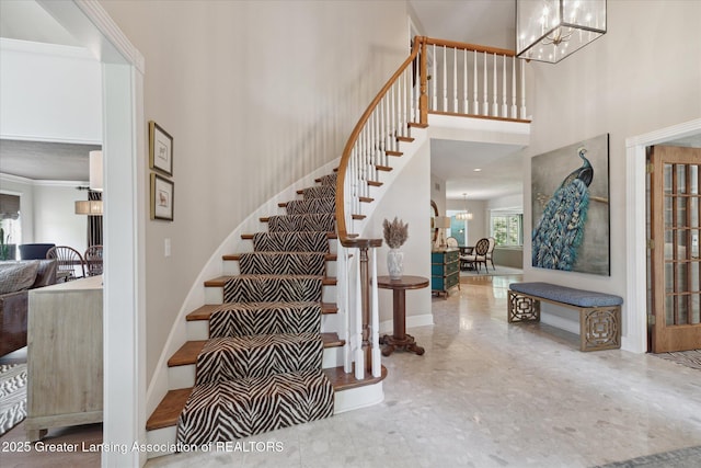 3641 Beech Tree Ln, Okemos, MI 48864 - stairs featuring a chandelier and a towering ceiling