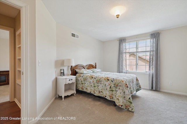 3641 Beech Tree Ln, Okemos, MI 48864 - carpeted bedroom with baseboards