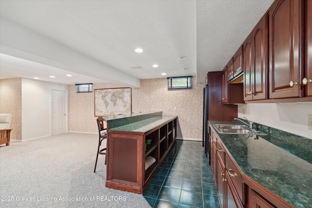3641 Beech Tree Ln, Okemos, MI 48864 - kitchen featuring wallpapered walls, recessed lighting, open shelves, a kitchen bar, and open floor plan