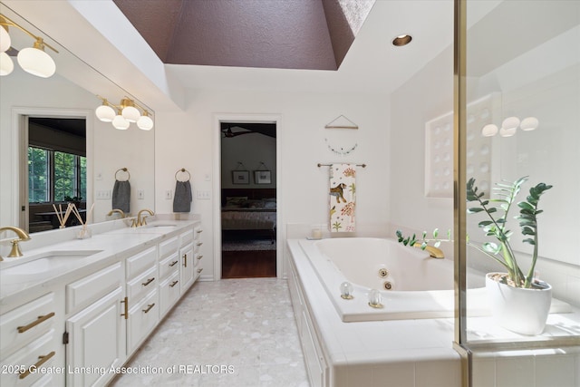 3641 Beech Tree Ln, Okemos, MI 48864 - ensuite bathroom with double vanity and a tub with jets