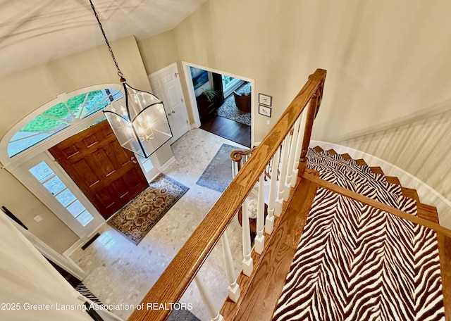 3641 Beech Tree Ln, Okemos, MI 48864 - stairway with a high ceiling and baseboards