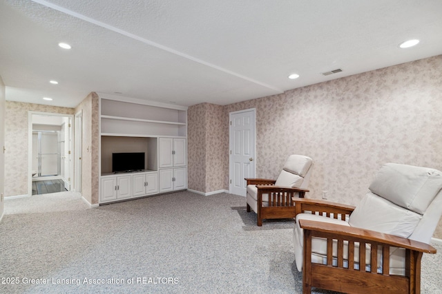 3641 Beech Tree Ln, Okemos, MI 48864 - living area featuring wallpapered walls, carpet, and recessed lighting