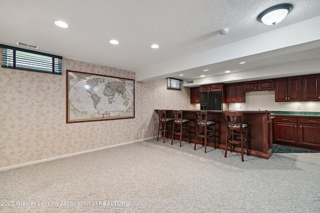 3641 Beech Tree Ln, Okemos, MI 48864 - kitchen featuring refrigerator with ice dispenser, light carpet, a breakfast bar area, wallpapered walls, and recessed lighting