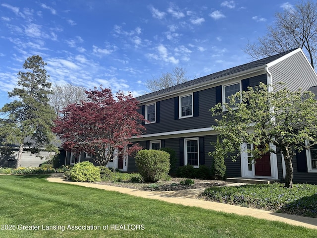 1425 E Lakeside Dr, East Lansing, MI 48823 - view of front facade with a front yard