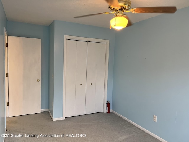 1425 E Lakeside Dr, East Lansing, MI 48823 - unfurnished bedroom featuring carpet floors, baseboards, and a closet
