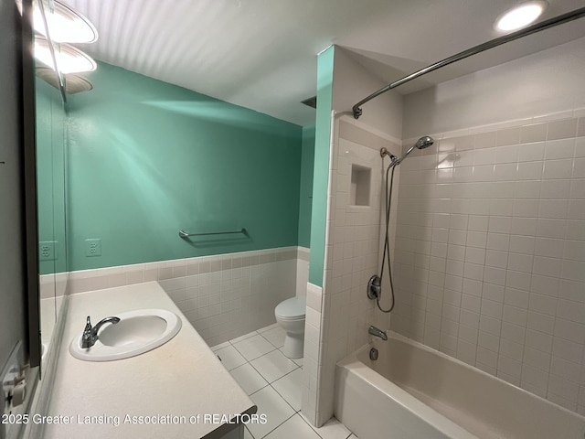 1425 E Lakeside Dr, East Lansing, MI 48823 - full bathroom featuring tile walls, tile patterned flooring, bathtub / shower combination, vanity, and toilet