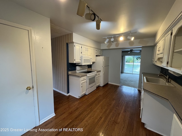 1425 E Lakeside Dr, East Lansing, MI 48823 - kitchen with white appliances, baseboards, ceiling fan, rail lighting, and a sink