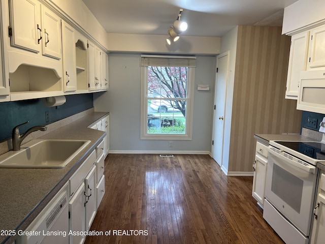 1425 E Lakeside Dr, East Lansing, MI 48823 - kitchen with white appliances, baseboards, white cabinetry, a sink, and dark wood finished floors